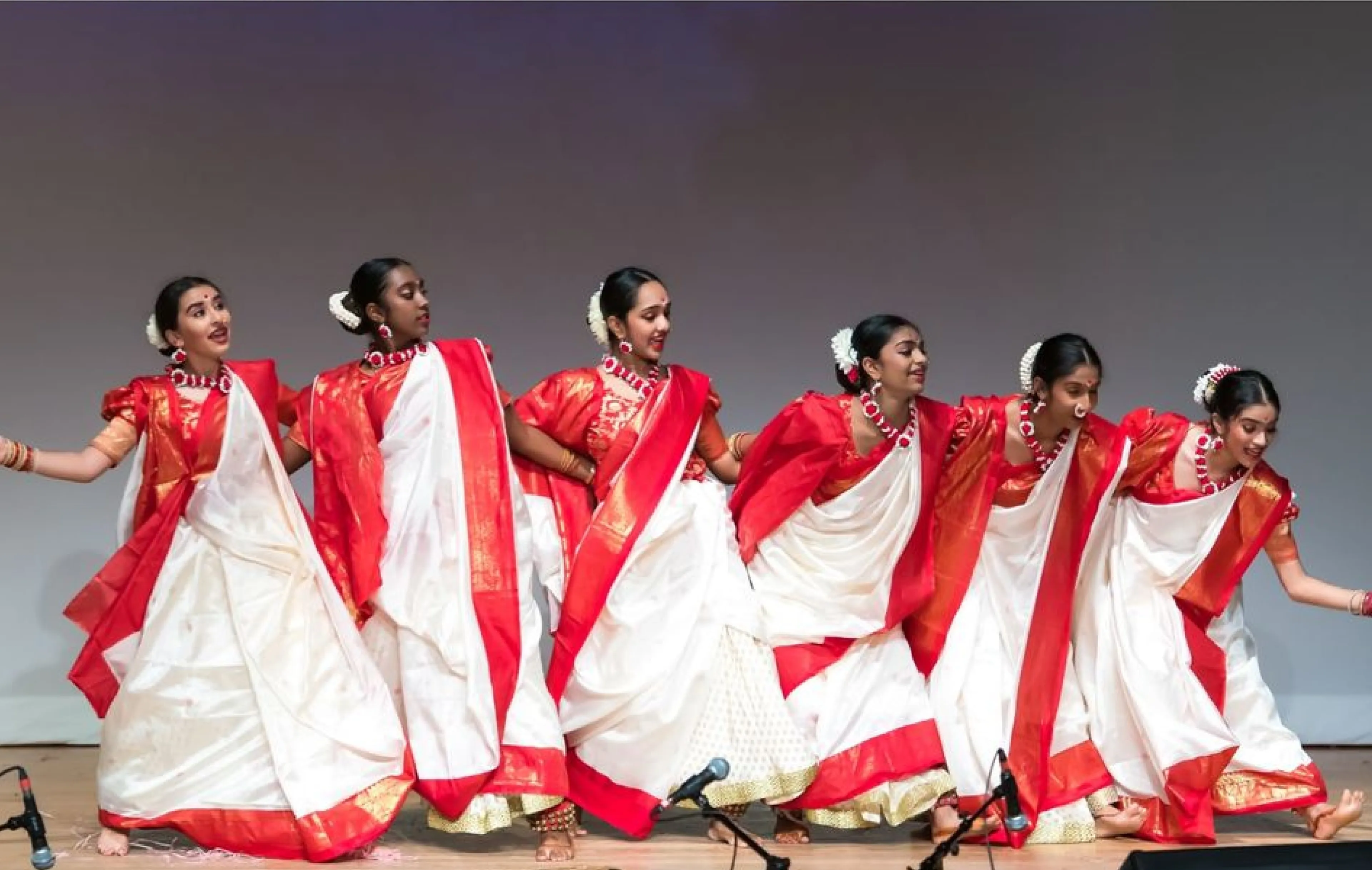 NSDA dancers performing Jhumur on stage