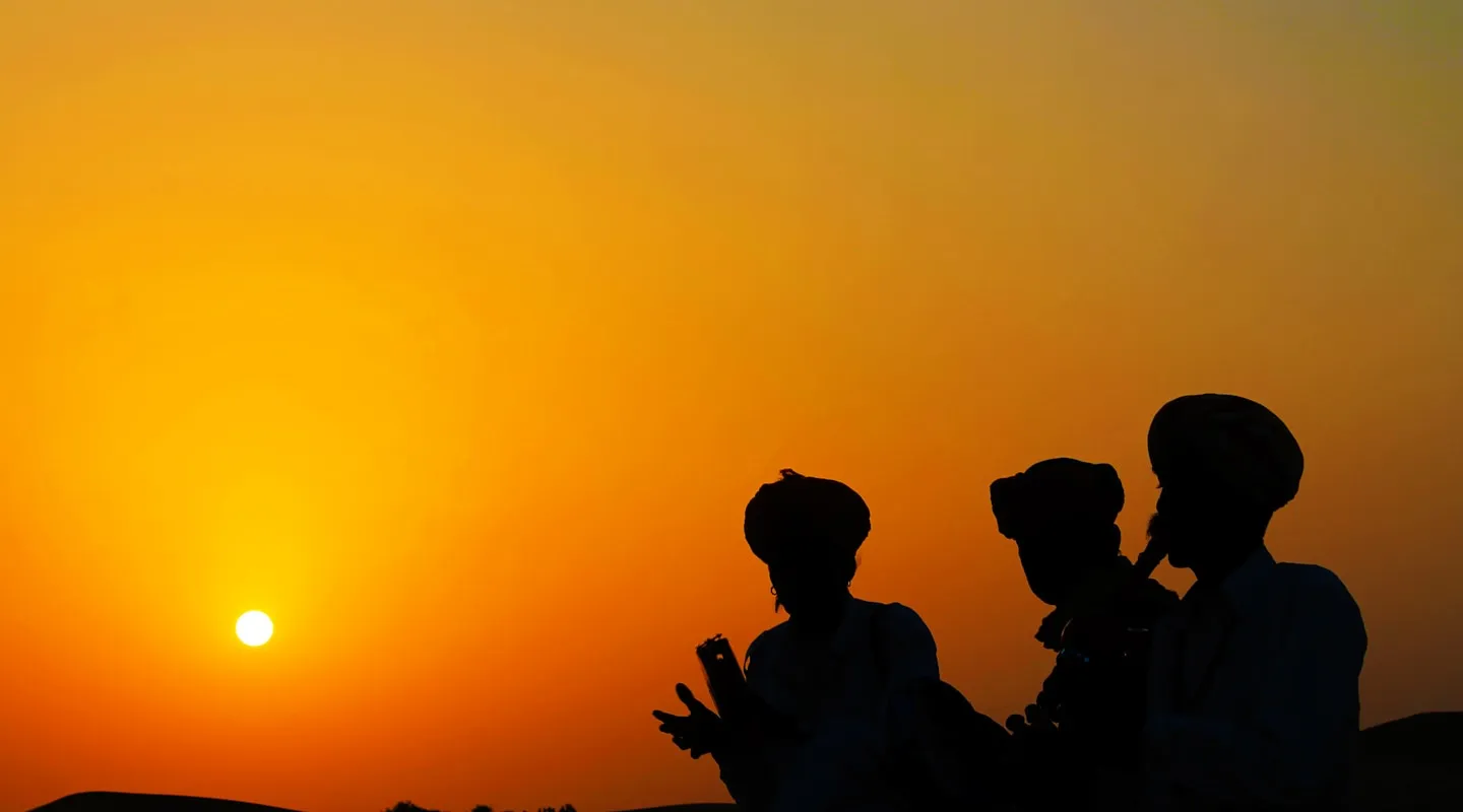 Kalbelia musicians performing in the desert