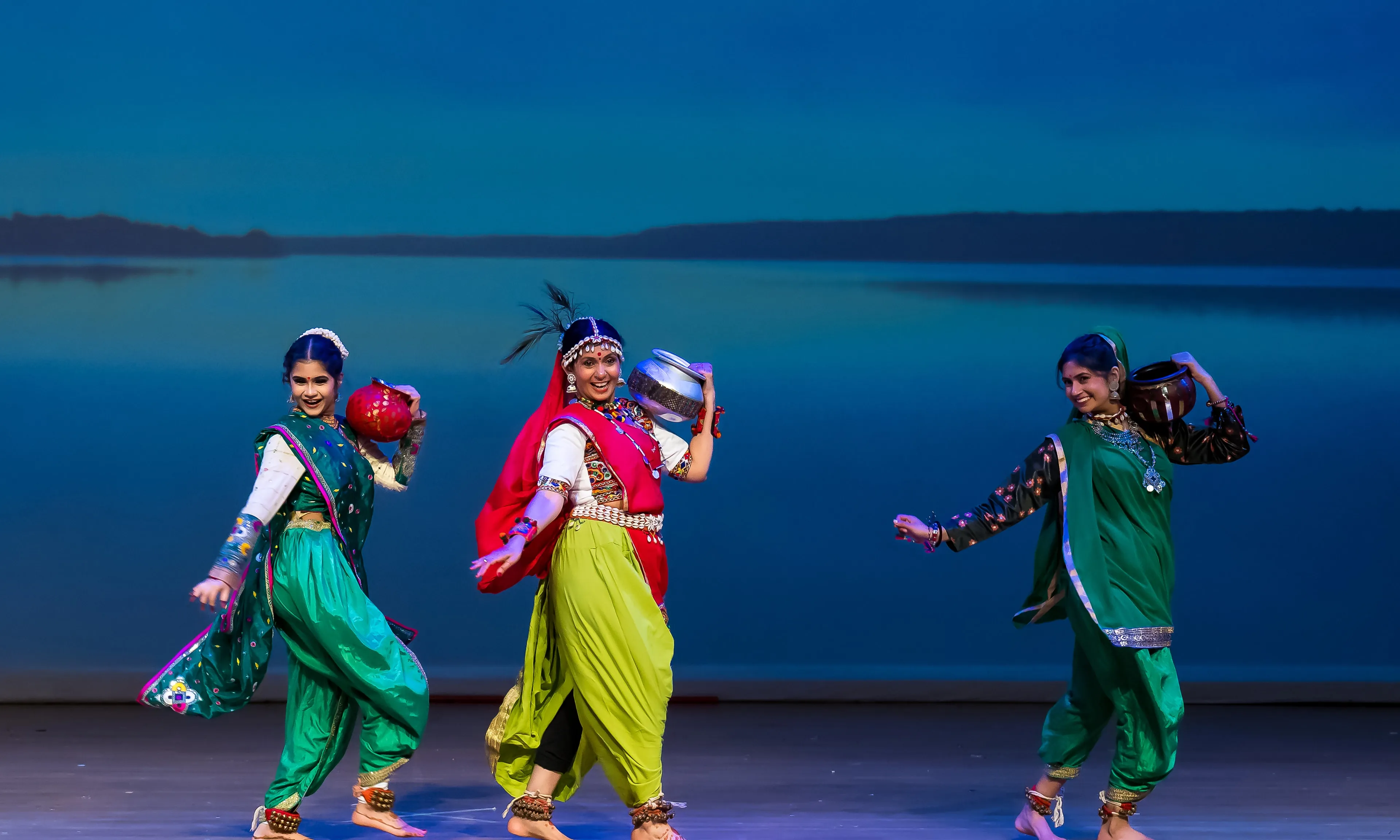 NSDA dancers performing Rathwa on stage, water pots on their shoulders