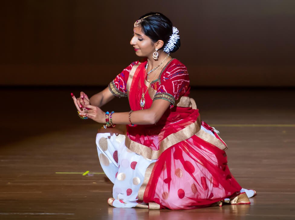 An NSDA Elite student showcasing footwork and mudras on stage