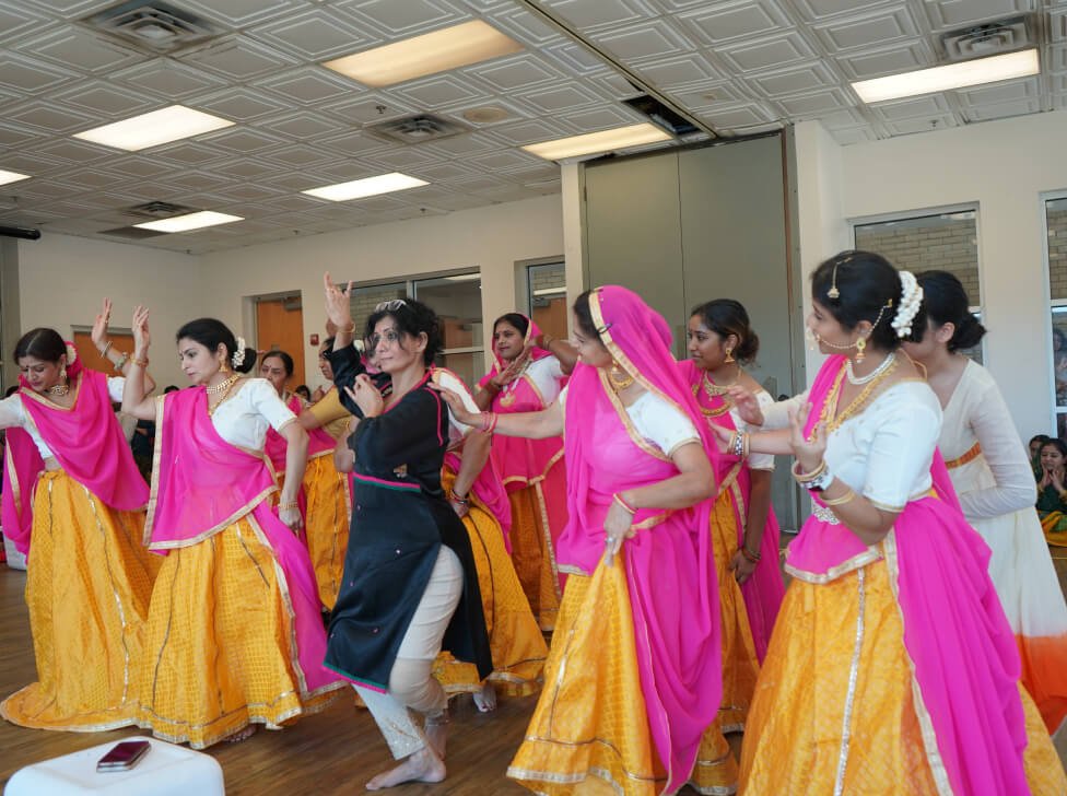 Vandita Parikh guiding students at different skill levels during a dance class